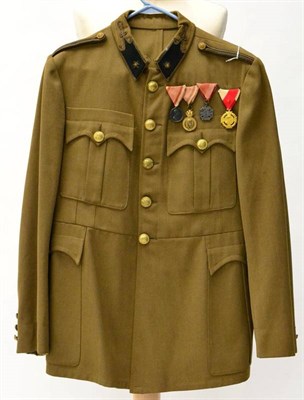 Lot 202 - An Austro-Hungarian Officer's Khaki Tunic, with gilt bullion star embroidered black wool collar...