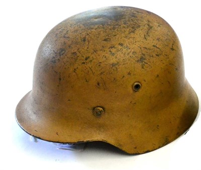 Lot 207 - A German Third Reich Luftwaffe M35 Helmet, with North Africa camouflage painted finish, the...