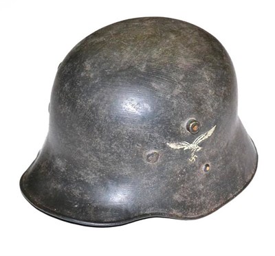 Lot 208 - A German Third Reich Luftwaffe M16 Austrian Re-issue Helmet, repainted and with single...