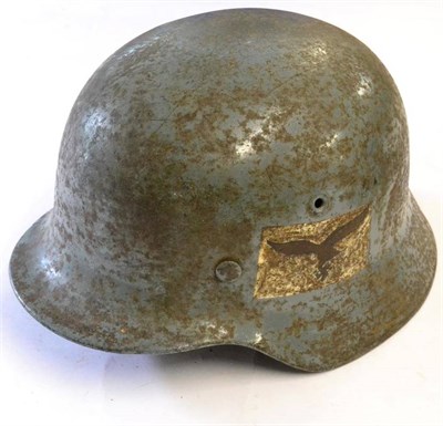 Lot 215 - A Second World War German Third Reich M35 Helmet, finished in light grey and with replica Luftwaffe