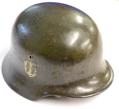 Lot 216 - A Second World War German Third Reich M35 Helmet, finished in grey / green, bearing single SS...