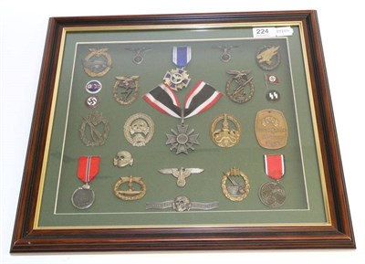 Lot 224 - A Framed Display of German Third Reich Medals, including U-boat War Badge, Winter Campaign in...