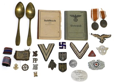 Lot 227 - A Small Collection of German Third Reich Collectables, including a Soldbuch, Wehrpass, badges,...