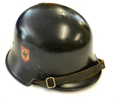 Lot 235 - A German Third Reich Police Helmet, the black painted shell with double decals, the left inner brim