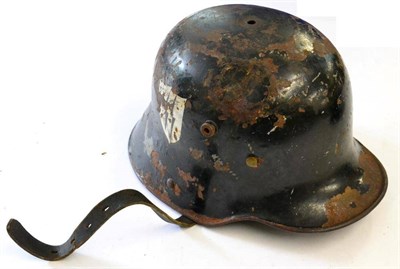 Lot 236 - A German M18 Army Helmet, later painted black with SS decal, leather nine tongue liner and...