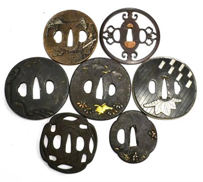 Lot 260 - A Collection of Seven Japanese Tsuba, including three iron examples with shakudo decoration, two of