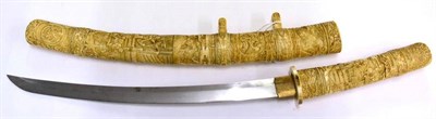 Lot 268 - A Shinto Japanese Marine Ivory Wakizashi, circa 1700, with 36cm blade, one piece brass habaki,...