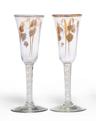 Lot 11 - A Pair of Ale Glasses, circa 1765, the round funnel bowls gilded with a pair of barley heads...