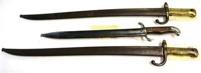 Lot 318 - Two French Model 1866 Chassepot Yataghan sword bayonets, with scabbards, and an Argentine Model...