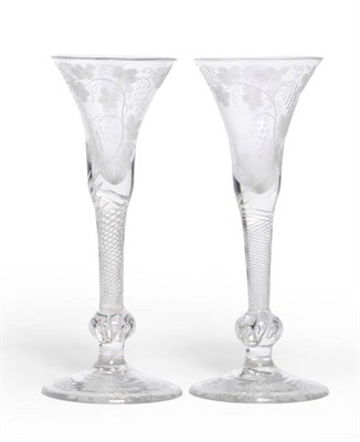 Lot 12 - A Pair of Wine Glasses, circa 1750, the drawn and waisted trumpet bowls wheel engraved and polished