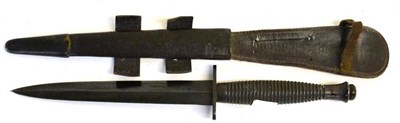 Lot 338 - A Post War Commando Knife, 3rd Pattern, blackened finish, with hand forged double edge steel blade