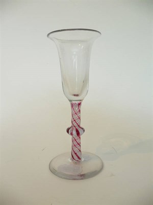 Lot 14 - A Dutch Colour Twist Wine Glass, circa 1770, the trumpet bowl on a single cushion knopped stem with