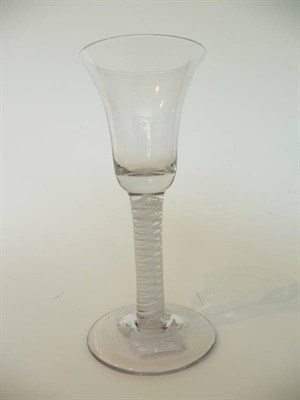 Lot 15 - A Wine Glass, circa 1765, the trumpet bowl on a double series opaque twist stem comprising a...
