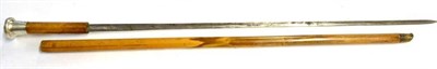 Lot 392 - A George V Malacca Swordstick, with 67cm plain steel blade, the handle with silver mushroom...