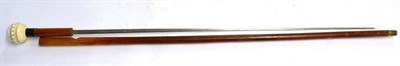 Lot 400 - A Late 19th Century Malacca Swordstick, with 67cm double edge steel blade, the grip with silver...