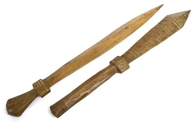 Lot 410 - Two Samoan Sword Clubs, each lightly carved with bands of geometric motifs and inscribed in ink...