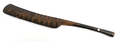 Lot 412 - A South Sea Islands War Club, the elongated head of ";cut-throat razor"; shape, incised and stained