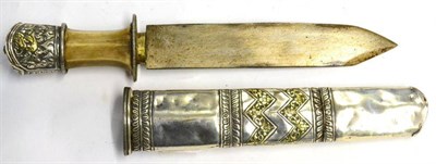 Lot 436 - A Late 19th Century Tibetan Knife, with 17cm clip point blade, white metal hilt with shallow...