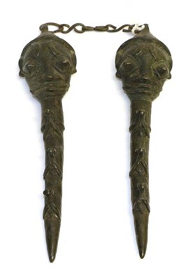 Lot 449 - A Yoruba Edan Oshugbo Society (Nigeria) Cast Brass Staff, each section as a stylised head above...