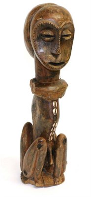 Lot 455 - An African Carved Wood and Cowrie Shell-Inlaid Janus Figure, possibly Hemba (Democratic Republic of