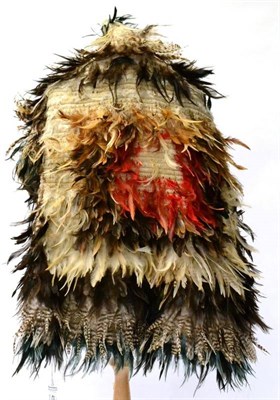 Lot 456 - A Maori Korowai (Feather Cloak), of woven flax incorporating concentric bands of various blue, red