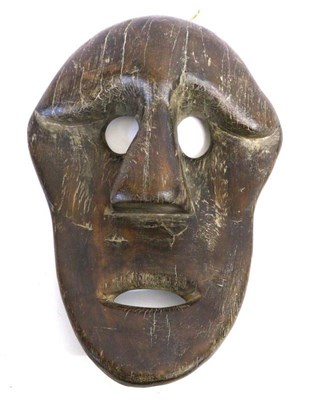 Lot 459 - A Carved Wood Plaque Mask, possibly North American Indian, with dished oval face, pierced...