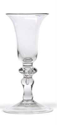 Lot 34 - A Baluster Wine Glass, circa 1730, the bell bowl on an hollow compressed cushion knop and...
