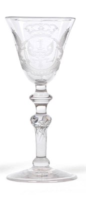 Lot 35 - A Wine Glass, circa 1740, the round funnel bowl Dutch engraved with an armorial comprising two...