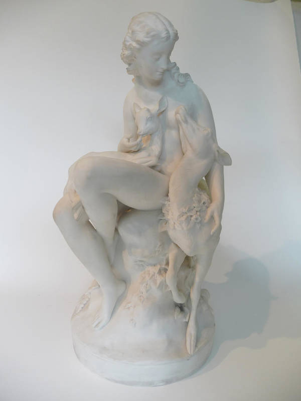 Lot 45 - A Parian Group of a Wood Nymph, circa 1870, after a model by C B Birch, sitting on a rocky...