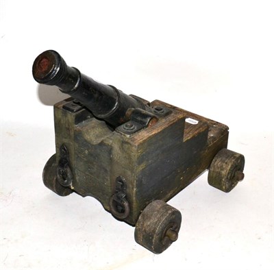 Lot 100 - A Cast Iron Model of a Signal Cannon, the 45.5 cm ringed barrel cast with a rose adjacent to...