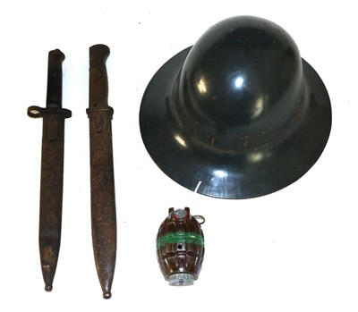 Lot 109 - A Collection of Militaria, comprising a Brodie helmet, painted grey, stamped ";M"; to the brim...