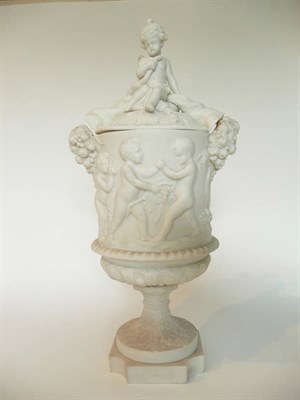Lot 48 - A Copeland Parian Urn Shaped Vase and Cover, circa 1860, the leaf sheathed cover with putto...