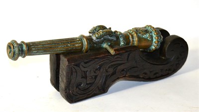 Lot 141 - An Early 20th Century Indonesian/Dutch Lantaka, with 41cm barrel, lion mask cascabel, spurious...