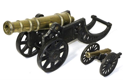 Lot 144 - A Cast Brass Model of a Cannon, with ball cascabel, circular section trunnions and ringed...