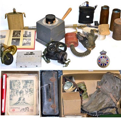 Lot 152 - A Collection of Militaria, including eleven various gas masks, a gas mask for a baby, brass...