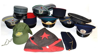 Lot 175 - A Collection of Thirteen Various Military Caps, including Russian Army dress visor hat, Russian...