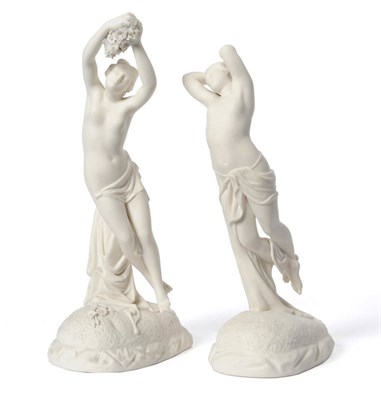 Lot 53 - A Pair of Parian Figures of Classical Maidens, circa 1885, each scantily draped figure holding...