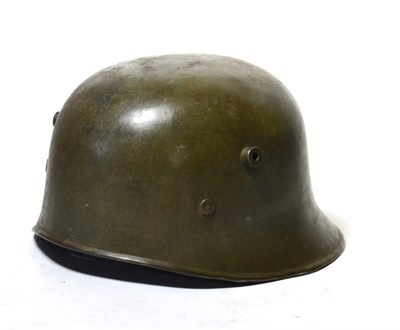 Lot 179 - A Rare First World War Turkish Helmet, cut down from a German M17 helmet, with uneven rolled...