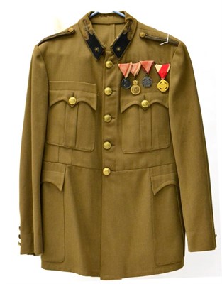 Lot 181 - A Hungarian Officer's Khaki Tunic, with gilt bullion star embroidered black wool collar tabs,...