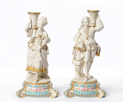 Lot 54 - A Pair of Parian Figural Candlesticks, circa 1870, as an 18th century gallant and his lady,...