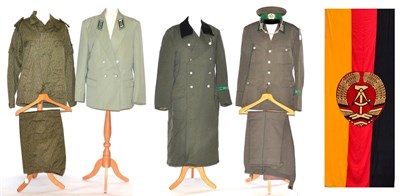 Lot 190 - An East German Border Guard's Uniform, comprising a pale green parade tunic, a green/grey tunic and