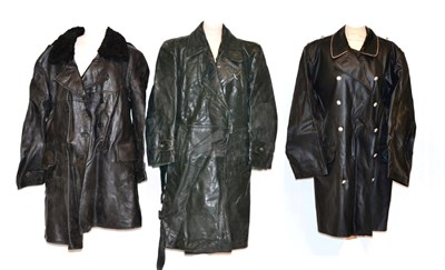 Lot 204 - A German Navy Black Leather Double Breasted Coat, with astrakan collar and grey wool lining; a...