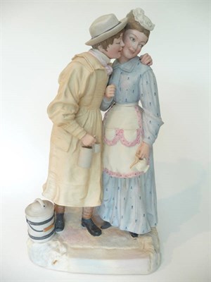 Lot 59 - A Tinted Parian Figure Group "Taking the Cream", circa 1890, the rustic milkman with his arm around