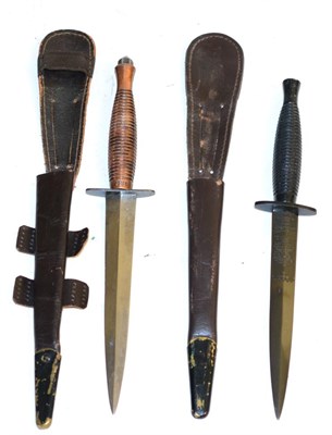 Lot 279 - An Elizabeth II Third Pattern Commando Knife by Wilkinson Sword, with blackened finish, the machine