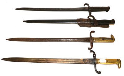 Lot 305 - Two Prussian M1871 Sword Bayonets, each with brass hilt, one side with diagonal grooves, the...