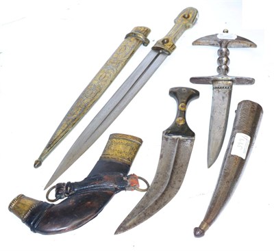 Lot 399 - A Russian Kindjal, the 32.5 cm blade with single fuller, niello and gilt hilt, conforming scabbard