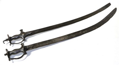 Lot 433 - An 18th Century Indian Talwar, with 80cm single edge curved steel blade, steel hilt with kidney...