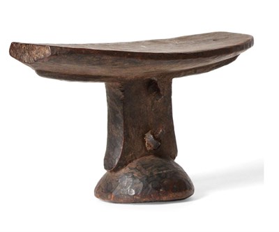 Lot 436 - An Early 19th Century Karamajong/Turkana Wood Headrest, Uganda, with slightly curved oblong...