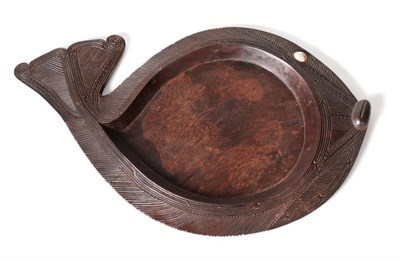 Lot 444 - A Maori Hardwood Platter, carved as a Pufferfish, the shallow recess within a chamfered flange...