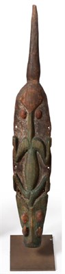 Lot 445 - A Papua New Guinea Flute Stopper, circa 1955, carved in soft wood as a stylised crocodile, the body